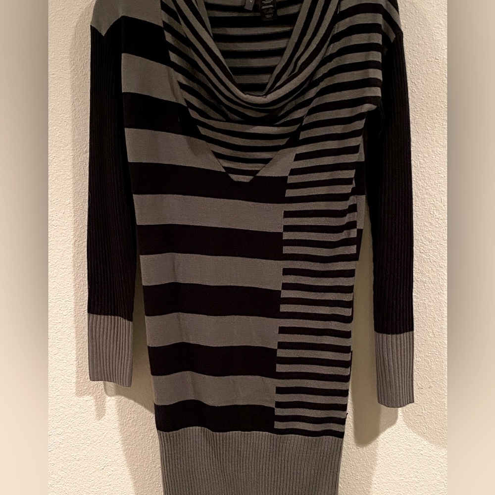 Beautiful black and grey sweater dress. Knee length and slim fit.